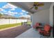 Backyard patio area with a grill, chairs and view of the fenced yard at 867 Vino Verde Cir, Brandon, FL 33511