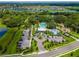 Overhead view of the community pool and splash pad with nearby parking at 9008 Waxwing Way, Parrish, FL 34219