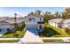 Two-story home features a gray exterior, well-kept lawn, and an attached two-car garage at 9008 Waxwing Way, Parrish, FL 34219