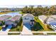 Charming two-story home with a well-maintained yard, driveway, and a pond view across the street at 9008 Waxwing Way, Parrish, FL 34219