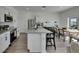 Bright kitchen showcases granite counters, stainless appliances, and an adjacent dining area at 9008 Waxwing Way, Parrish, FL 34219