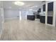 Expansive open-concept layout showcases the connection between the living area, dining, and kitchen at 9308 Pinero St, Spring Hill, FL 34608