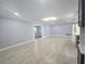 Spacious open living area boasts recessed lighting and wood-look tile flooring for a contemporary look at 9308 Pinero St, Spring Hill, FL 34608