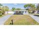 Charming single-story home with covered porch and well-maintained lawn at 10309 108Th Ave, Largo, FL 33773