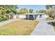 Quaint single-Gathering home with a covered entry and a well-manicured front yard at 10309 108Th Ave, Largo, FL 33773