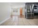 Modern kitchen featuring stainless steel appliances, grey cabinetry, and designer backsplash at 10309 108Th Ave, Largo, FL 33773
