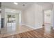 Inviting space connecting a tiled dining area with a cozy living area and outdoor access at 10309 108Th Ave, Largo, FL 33773