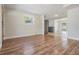 Open layout with wood-look flooring and access to an updated kitchen and outdoor space at 10309 108Th Ave, Largo, FL 33773