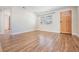 Inviting living room with wood floors, natural light, and a charming front door at 10309 108Th Ave, Largo, FL 33773