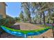 Enjoy outdoor relaxation with this backyard hammock and views of the spacious, fenced yard at 10315 Riverdale Rise Dr, Riverview, FL 33578