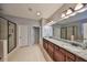Spacious bathroom offers double sinks, granite countertops, walk-in shower, and a soaking tub at 10315 Riverdale Rise Dr, Riverview, FL 33578