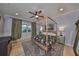 Primary bedroom features a decorative ceiling fan and dark wooden floors at 10315 Riverdale Rise Dr, Riverview, FL 33578