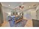 Bright bedroom showcases a four-poster bed, ceiling fan, and elegant trim work at 10315 Riverdale Rise Dr, Riverview, FL 33578