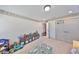 Bright bedroom with plush carpet, and natural light at 10315 Riverdale Rise Dr, Riverview, FL 33578