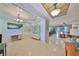 Open-concept living space featuring tile flooring, decorative ceiling, and bright, airy atmosphere at 10315 Riverdale Rise Dr, Riverview, FL 33578