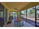 Relaxing screened patio with outdoor seating, ceiling fan, and serene views at 10315 Riverdale Rise Dr, Riverview, FL 33578