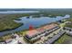 Expansive aerial view highlighting the community's proximity to the water and boat docks at 1076 Paseo Del Rio Ne, St Petersburg, FL 33702