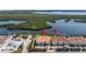 Aerial view of waterfront condos with boat docks and lush green surroundings at 1076 Paseo Del Rio Ne, St Petersburg, FL 33702