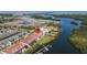 Stunning aerial view of waterfront condos with private docks and lush landscaping near the bay and causeway at 1076 Paseo Del Rio Ne, St Petersburg, FL 33702