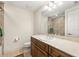 Bright bathroom featuring a vanity with a marble countertop, sliding glass shower doors, and a toilet at 1076 Paseo Del Rio Ne, St Petersburg, FL 33702