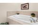 Elegant bathtub with tile surround, perfect for relaxation at 1076 Paseo Del Rio Ne, St Petersburg, FL 33702