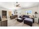 The bonus room features a ceiling fan, desk, couch, and natural light at 1076 Paseo Del Rio Ne, St Petersburg, FL 33702