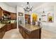 Kitchen boasts granite countertops, stainless appliances, and island with seating at 1076 Paseo Del Rio Ne, St Petersburg, FL 33702