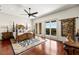 Spacious bedroom with hardwood floors, ceiling fan, and balcony access at 1076 Paseo Del Rio Ne, St Petersburg, FL 33702