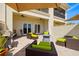 This spacious patio features outdoor furniture, a grill, and retractable awnings at 1076 Paseo Del Rio Ne, St Petersburg, FL 33702