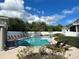 Beautiful community pool with lounge chairs and lush landscaping, perfect for relaxation and enjoyment at 1076 Paseo Del Rio Ne, St Petersburg, FL 33702