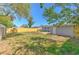 View of the backyard with grass and privacy fence at 10928 N 15Th St, Tampa, FL 33612