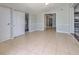 Spacious bonus room features neutral paint, tile flooring, and closet space at 10928 N 15Th St, Tampa, FL 33612