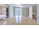 Bonus room with natural light features neutral paint, tile flooring, and exterior access at 10928 N 15Th St, Tampa, FL 33612