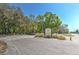 Sign for Copeland Park at an intersection, surrounded by trees and lush landscaping at 10928 N 15Th St, Tampa, FL 33612
