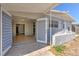 Covered patio offers indoor/outdoor living space with tiled flooring and access to the home at 10928 N 15Th St, Tampa, FL 33612