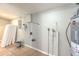 Utility room features tile flooring, Rheem water heater, and plumbing fixtures at 10928 N 15Th St, Tampa, FL 33612