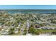 Serene aerial view of a well-maintained neighborhood near a scenic body of water at 11114 Freedom Way, Seminole, FL 33772