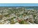 A lovely aerial view of a neighborhood close to a body of water on a sunny day at 11114 Freedom Way, Seminole, FL 33772