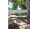 Backyard with mature trees, swing, and a white vinyl privacy fence at 11114 Freedom Way, Seminole, FL 33772