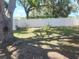 Large backyard featuring a white vinyl fence providing privacy at 11114 Freedom Way, Seminole, FL 33772