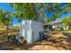 View of a backyard shed and patio area, perfect for storage and outdoor activities at 11114 Freedom Way, Seminole, FL 33772