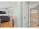 Charming bathroom features a tiled shower, wooden floors, and updated fixtures at 11114 Freedom Way, Seminole, FL 33772