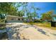 Charming single-story home with a well-maintained front yard, long driveway and mature shade trees at 11114 Freedom Way, Seminole, FL 33772