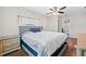 Spacious main bedroom featuring a ceiling fan, natural light, a dresser and wood floors at 11114 Freedom Way, Seminole, FL 33772