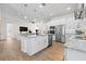 Modern kitchen with an island, seamlessly connecting to the living and dining areas in an open layout at 11215 53Rd N Ave, St Petersburg, FL 33708