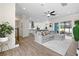 Spacious living room flowing into a modern kitchen, complete with sleek floors and abundant natural light at 11215 53Rd N Ave, St Petersburg, FL 33708