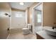 Clean bathroom with a tub/shower combo, a toilet, and a vessel sink on a vanity at 11310 Callaway Pond Dr, Riverview, FL 33579