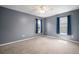 Bedroom featuring neutral carpet flooring, a ceiling fan and natural light at 11310 Callaway Pond Dr, Riverview, FL 33579