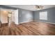 Bonus room boasting sleek laminate flooring and a charming ceiling fan at 11310 Callaway Pond Dr, Riverview, FL 33579
