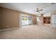 Open-concept floorplan with sliding glass doors in main bedroom providing scenic pool and lanai views at 11310 Callaway Pond Dr, Riverview, FL 33579